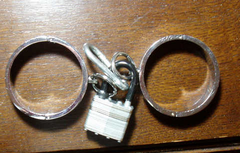 Steel cuffs, padlocked